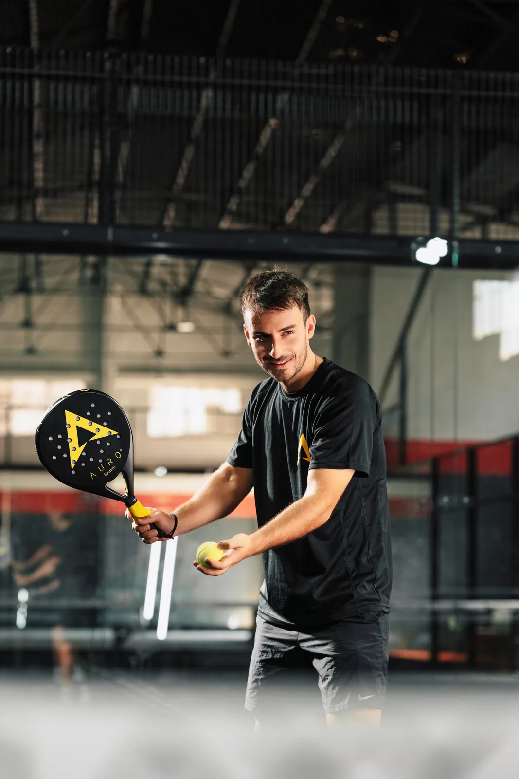 Player preparing the serve with the ball in hand