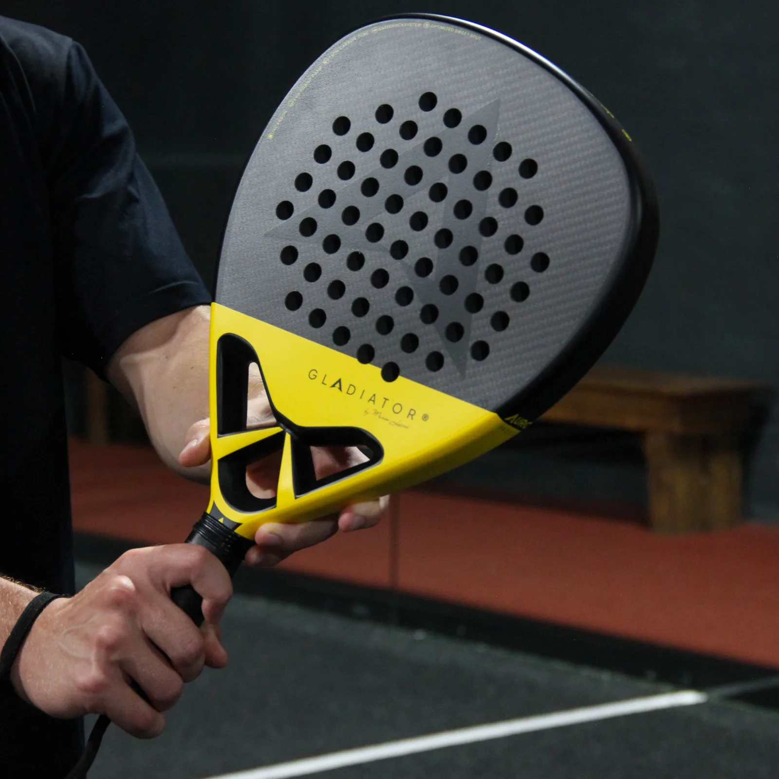 The Auro Gladiator held by the bridge, carbon face towards the camera